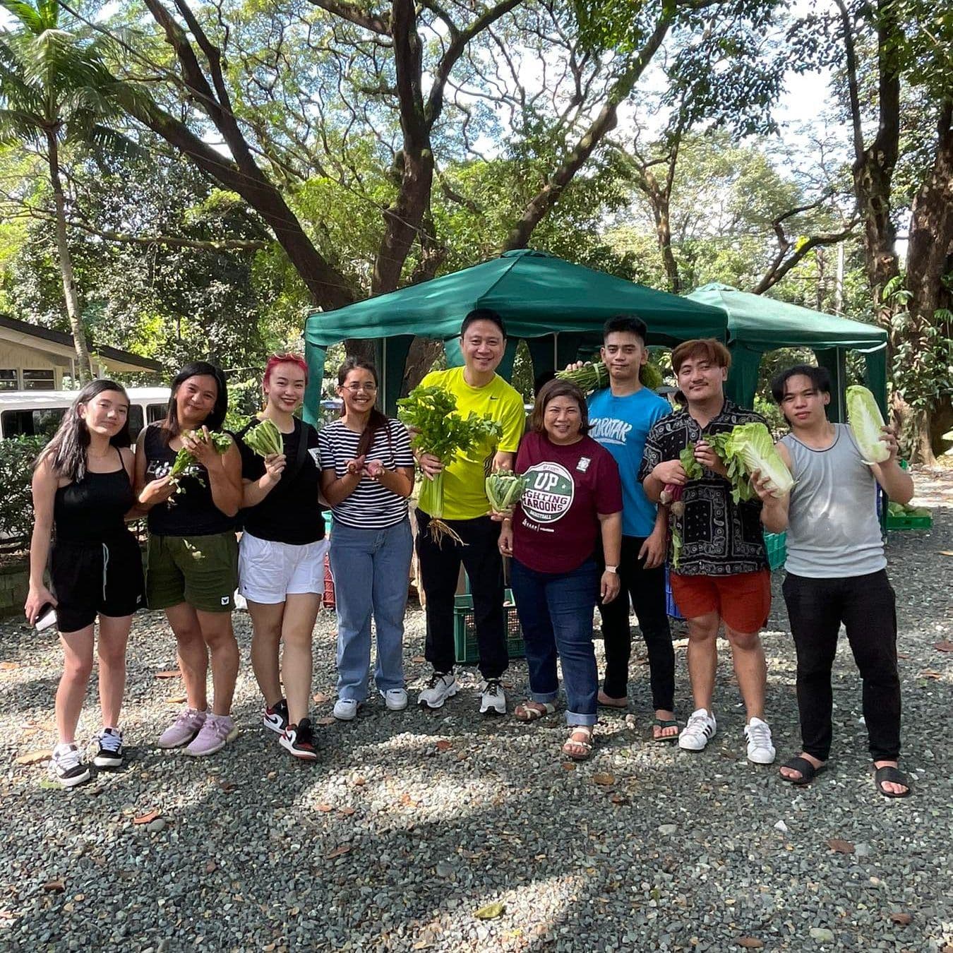 Farmers and volunteers at an FFI-supported weekend market